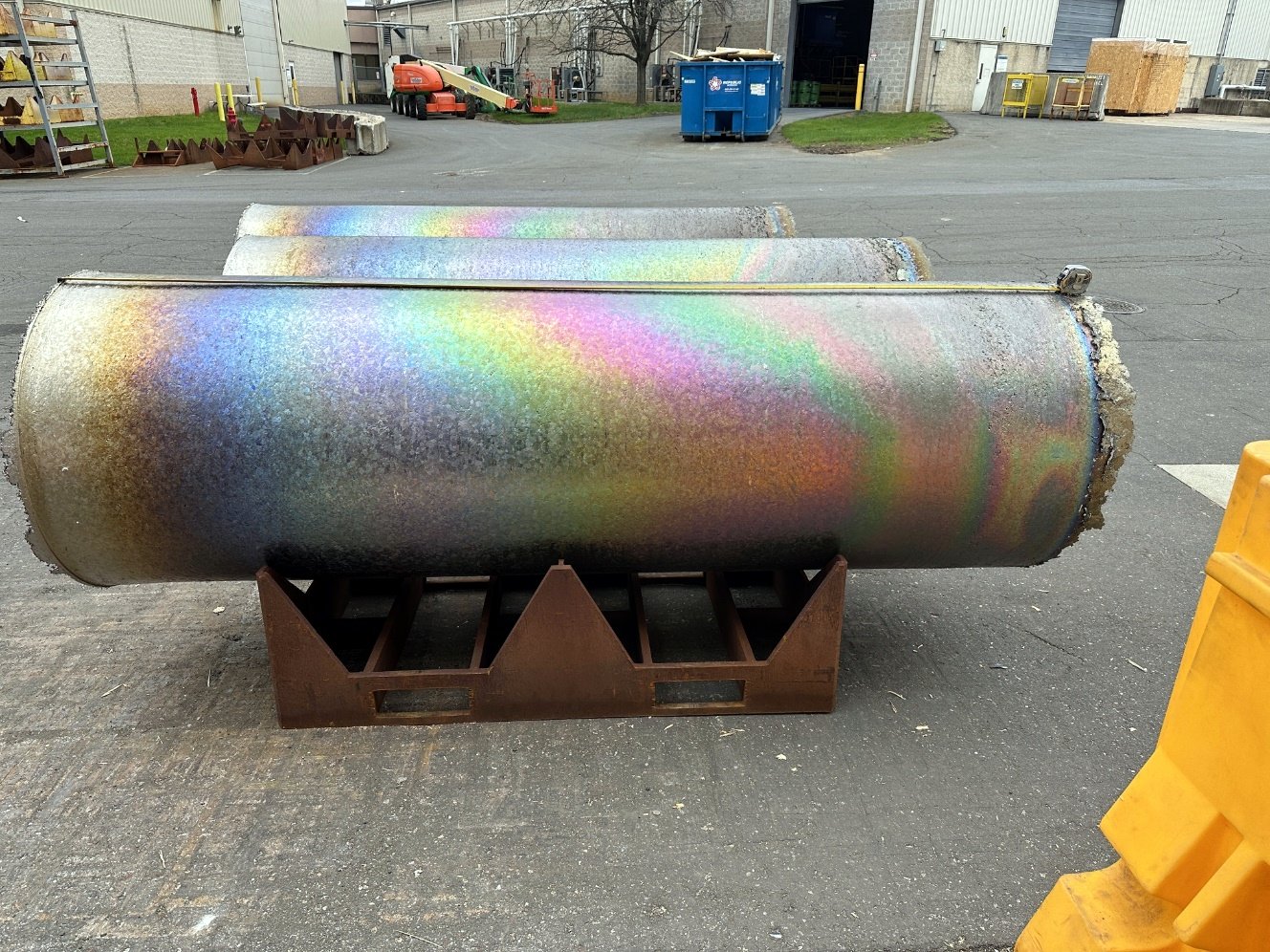 Photograph of a titanium ingot on stands with a smooth, uniform surface.