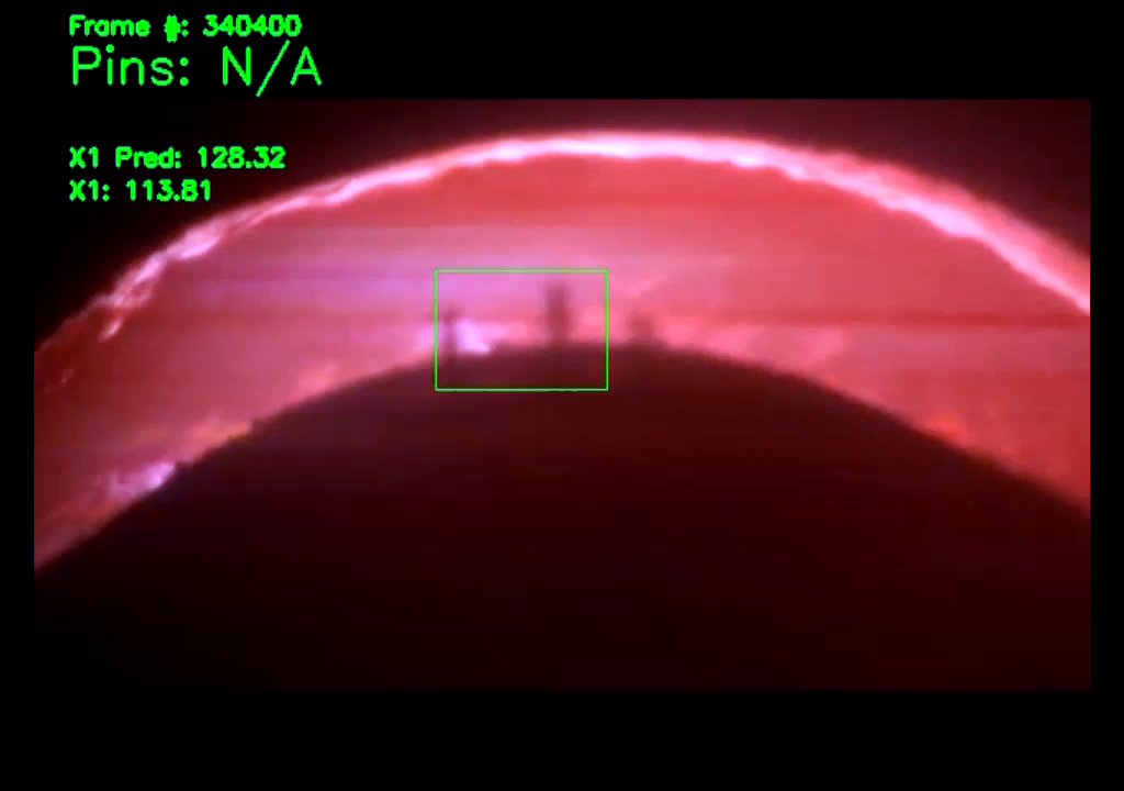 Dim red video frame of the electrode edge with pins faintly visible in a green box and the overlay reading pins N/A.